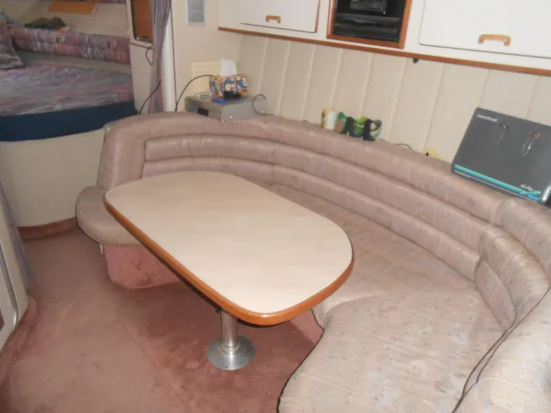 Slide: The Image of Interior of 1990 Sea Ray 350 Sundancer Coupe with white and red seating. - 4