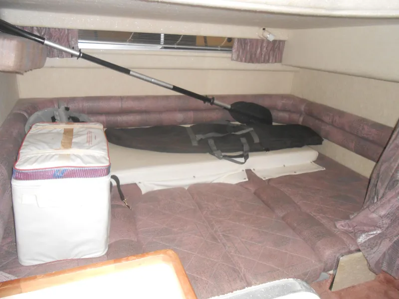 Slide: The Image of Interior cabin of 1990 Sea Ray 350 Sundancer Coupe with seating and storage. - 6