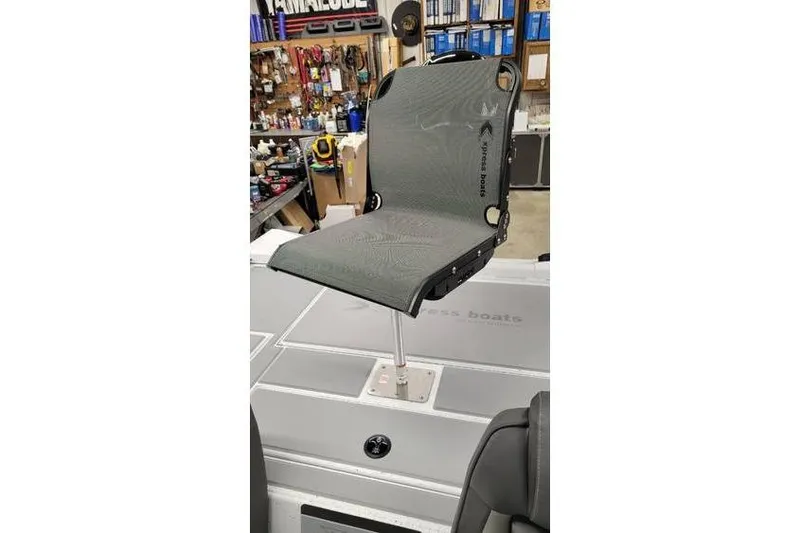 Slide: The Image of 2025 Xpress H20C Crappie boat seat in workshop setting. - 32