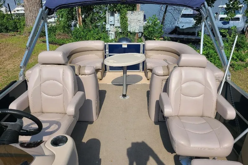 Slide: The Image of 2013 Starcraft Limited 236 Starlounger boat interior with plush seating and table. - 5