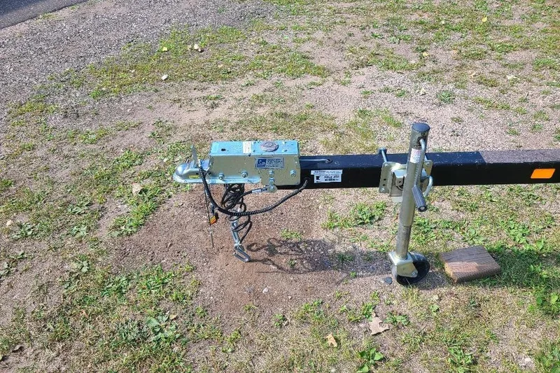 Slide: The Image of Trailer hitch and jack of a 2013 Starcraft Limited 236 Starlounger on grass. - 8