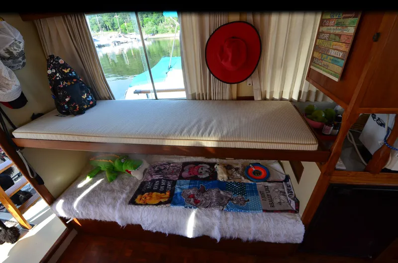 Slide: The Image of Cozy interior of 1977 Grand Banks GB 32 with bunk beds and colorful decor. - 16