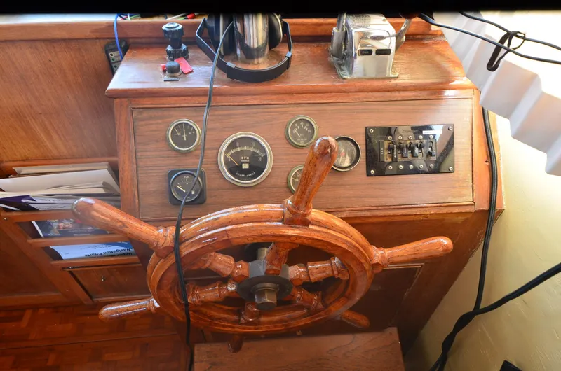 Slide: The Image of 1977 Grand Banks GB 32 helm with wooden wheel and instrument panel. - 18