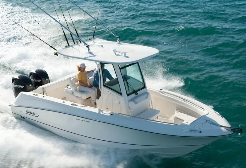 Slide: The Image of 2014 Boston Whaler 250 Outrage boat cruising on the ocean. - 25
