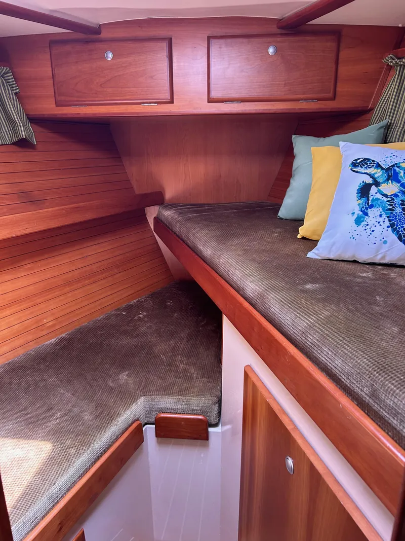 Slide: The Image of Cozy cabin interior of 2006 Southerly 115 Mk IV sailboat with cushions and storage. - 10