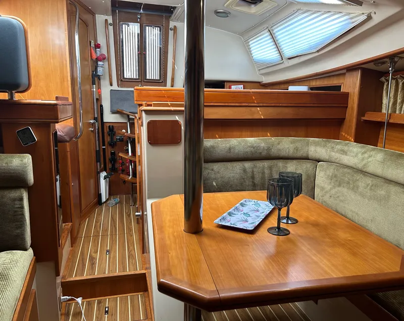 Slide: The Image of Interior of 2006 Southerly 115 Mk IV sailboat with wooden furnishings and cozy seating area. - 15