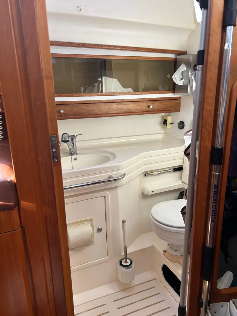Slide: The Image of Compact bathroom in 2006 Southerly 115 Mk IV sailboat with sink and toilet. - 17