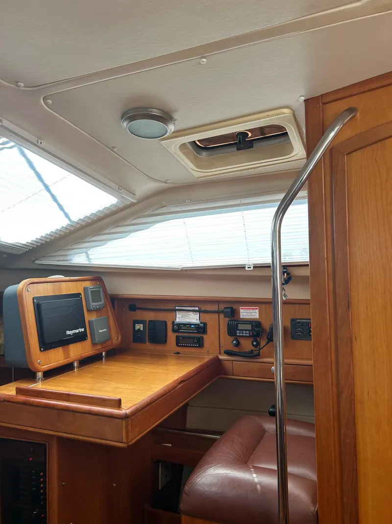 Slide: The Image of Interior of 2006 Southerly 115 Mk IV sailboat with navigation equipment and wooden finish. - 21