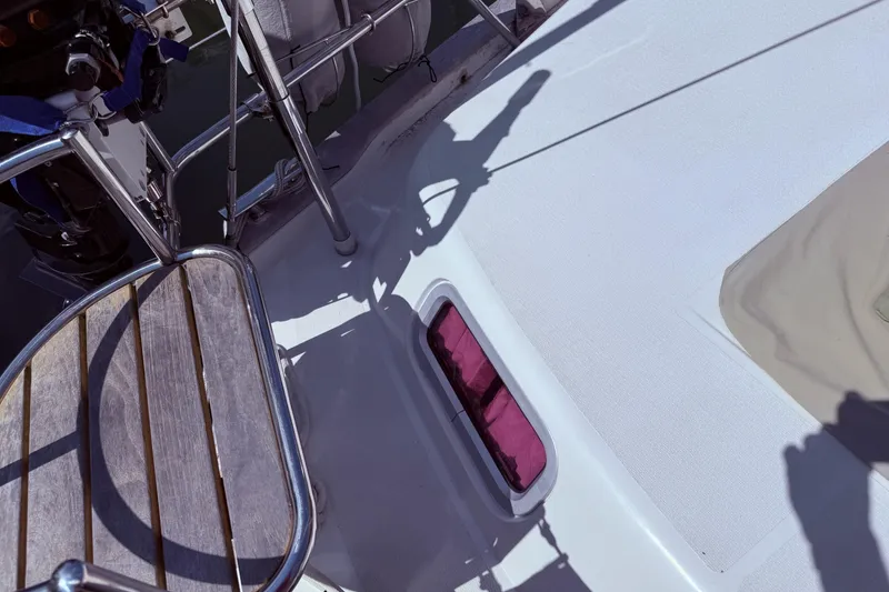 Slide: The Image of Deck view of 2006 Southerly 115 Mk IV sailboat with wooden seating and railing. - 34