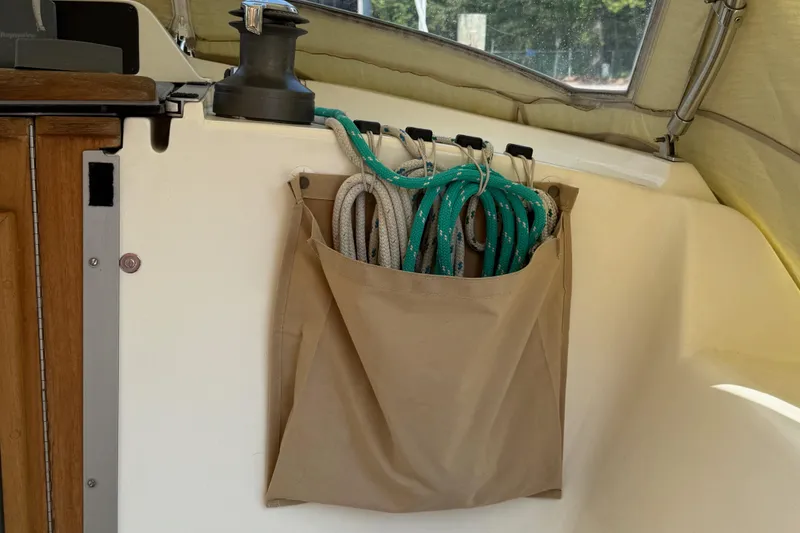 Slide: The Image of Rope storage on 2006 Southerly 115 Mk IV sailboat, featuring organized lines in a beige pouch. - 40
