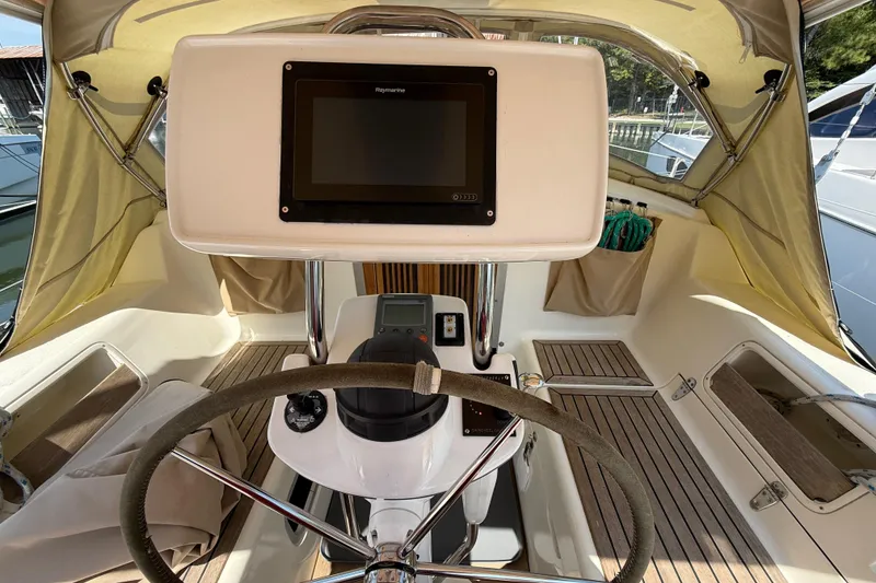 Slide: The Image of Cockpit of 2006 Southerly 115 Mk IV sailboat with steering wheel and navigation equipment. - 45