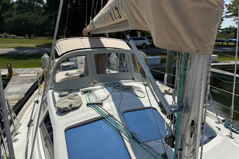 Slide: The Image of 2006 Southerly 115 Mk IV sailboat docked, featuring deck and rigging details. - 56