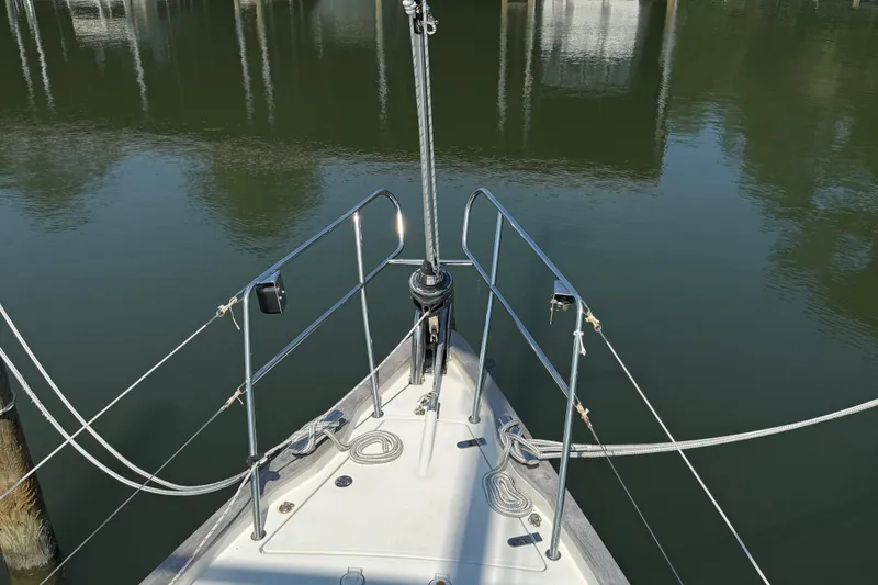 Slide: The Image of Bow of 2006 Southerly 115 Mk IV sailboat on calm water. - 60