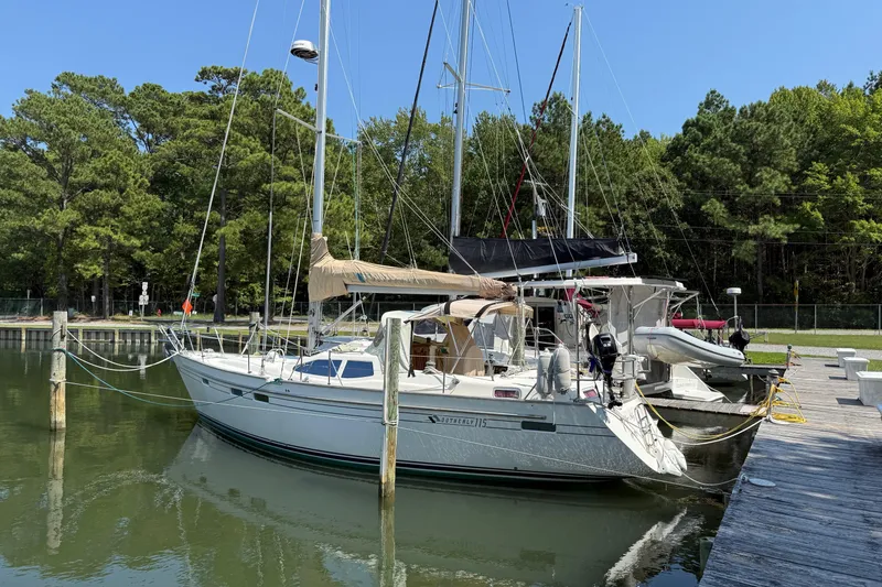 Slide: The Image of 2006 Southerly 115 Mk IV sailboat docked in a serene marina setting. - 69