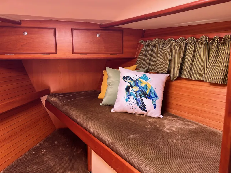 Slide: The Image of Cozy cabin interior of 2006 Southerly 115 Mk IV with turtle-themed pillow. - 8