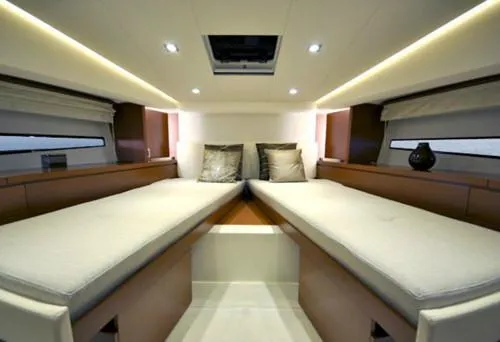 Slide: The Image of Interior of 2016 Prestige 450 S yacht with twin beds and modern lighting. - 14