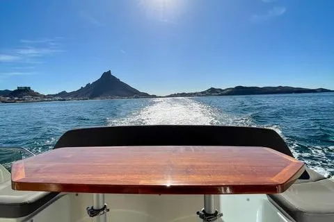 Slide: The Image of Prestige 450 S yacht cruising on open water with scenic mountain view, 2016 model. - 18