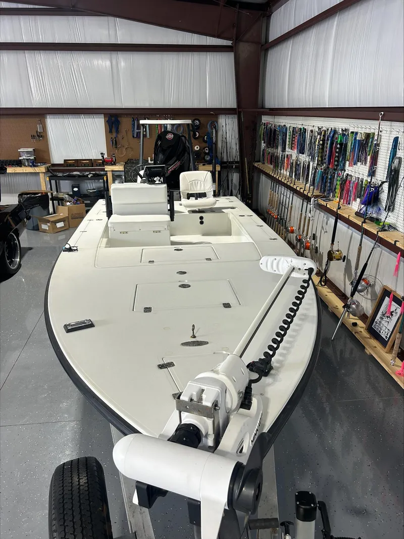 The Image of 2008 Lake & Bay Boca Grande boat in a garage with fishing gear. - 0