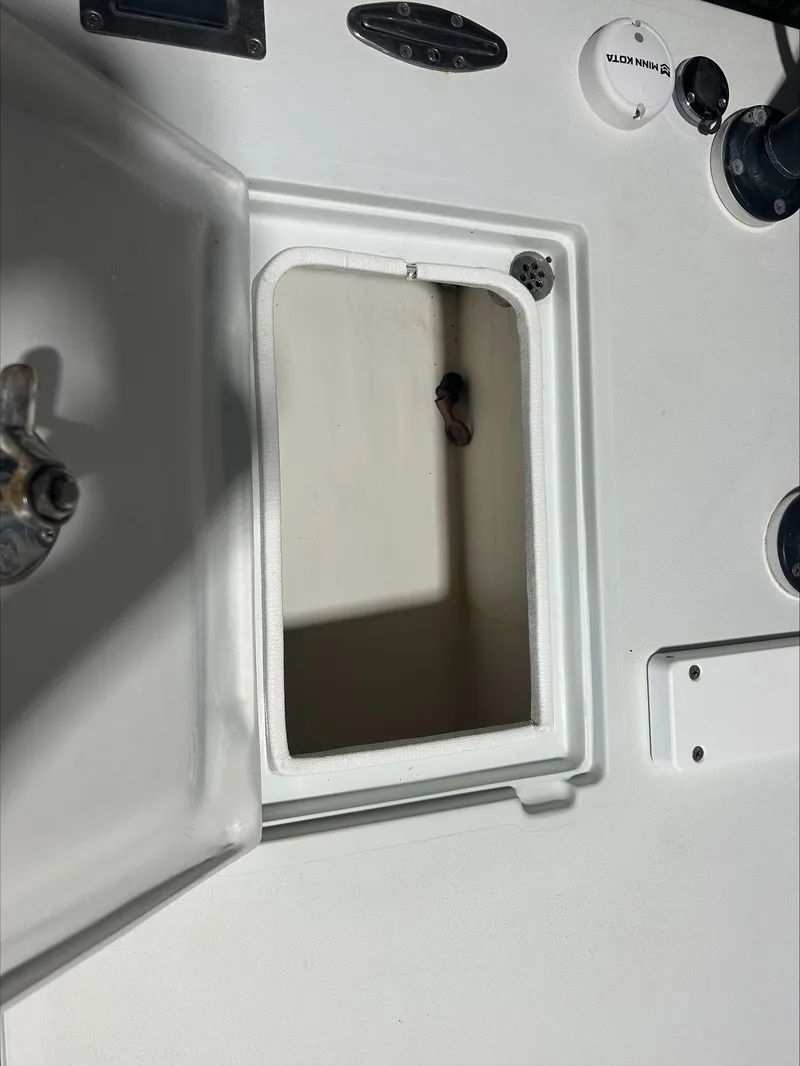 Slide: The Image of Open storage compartment on a 2008 Lake & Bay Boca Grande boat. - 14