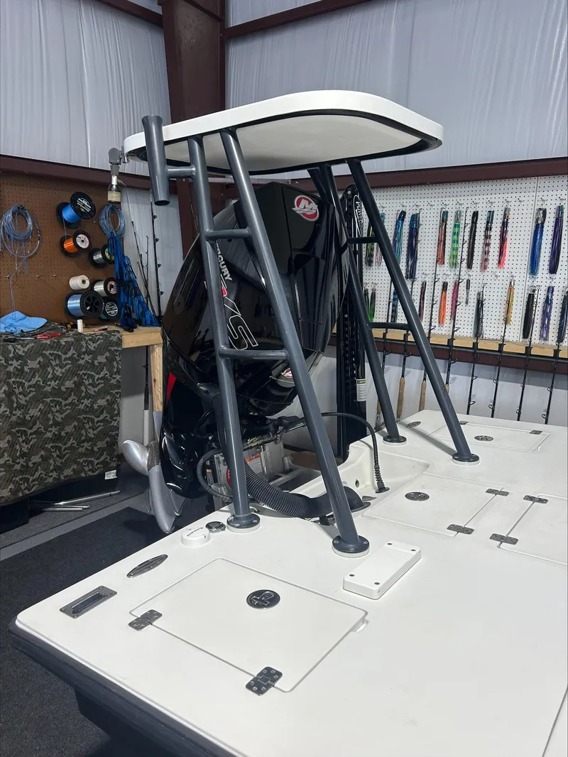 Slide: The Image of 2008 Lake & Bay Boca Grande boat in a garage, featuring a Mercury outboard motor. - 15