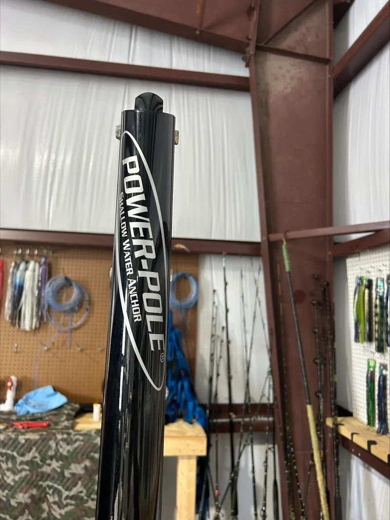 Slide: The Image of Power-Pole shallow water anchor in a workshop with fishing gear. - 18