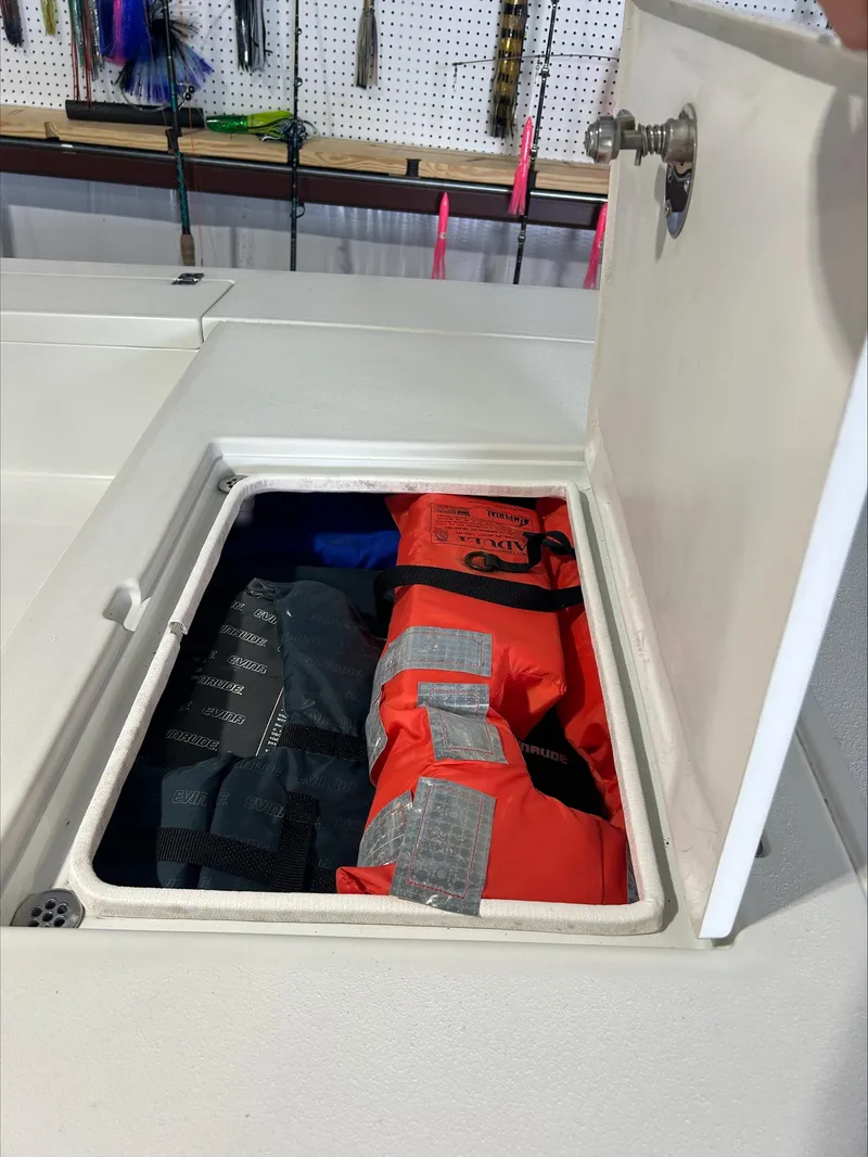 Slide: The Image of Storage compartment on a 2008 Lake & Bay Boca Grande boat with life jackets. - 7