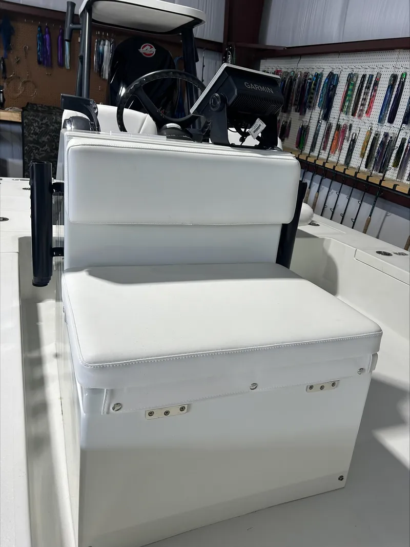 Slide: The Image of 2008 Lake & Bay Boca Grande boat interior with white seating and Garmin navigation system. - 8