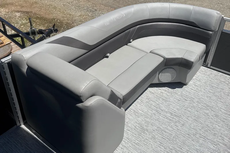 Slide: The Image of 2023 Bennington 22SX SWINGBACK boat seating with gray upholstery and speaker. - 13