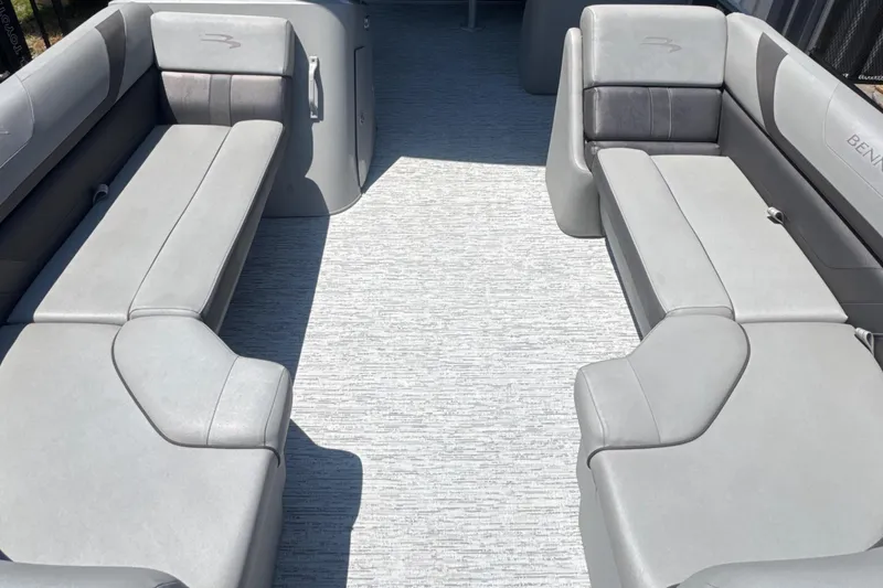 Slide: The Image of 2023 Bennington 22SX Swingback boat interior with gray seating and spacious layout. - 15