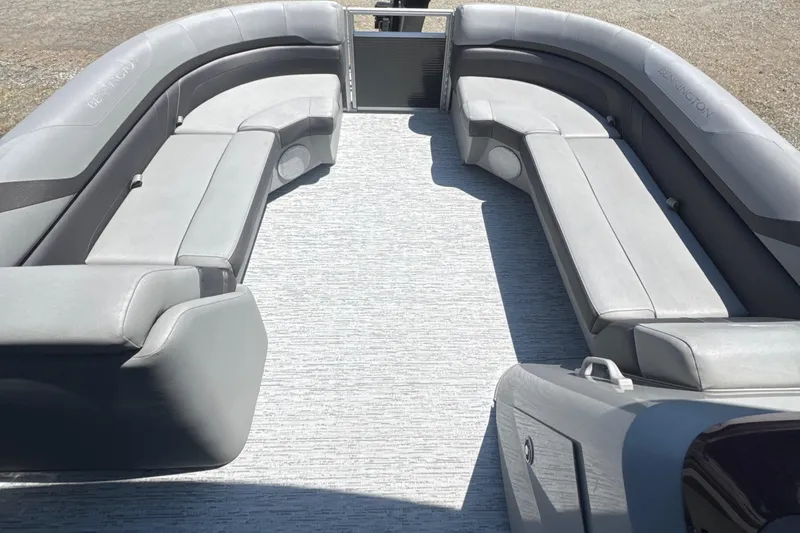 Slide: The Image of 2023 Bennington 22SX SWINGBACK boat interior with gray seating and spacious layout. - 18