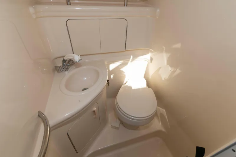 Slide: The Image of 2005 Sea Ray 280 Sundancer bathroom with sink and toilet. - 18