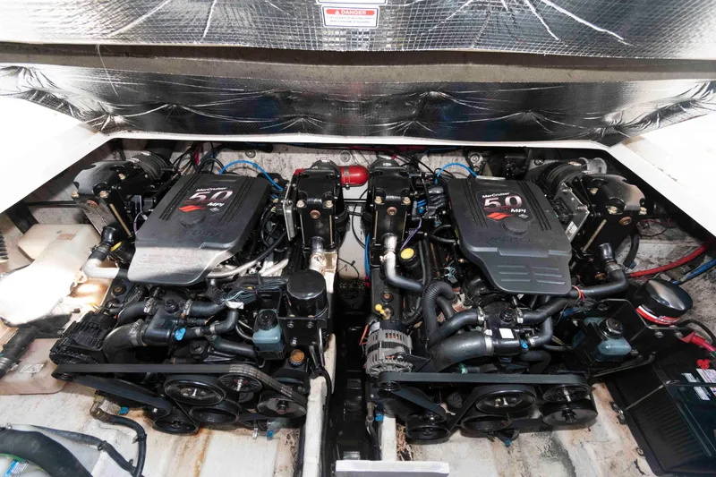 Slide: The Image of Twin MerCruiser engines in a 2005 Sea Ray 280 Sundancer boat. - 19