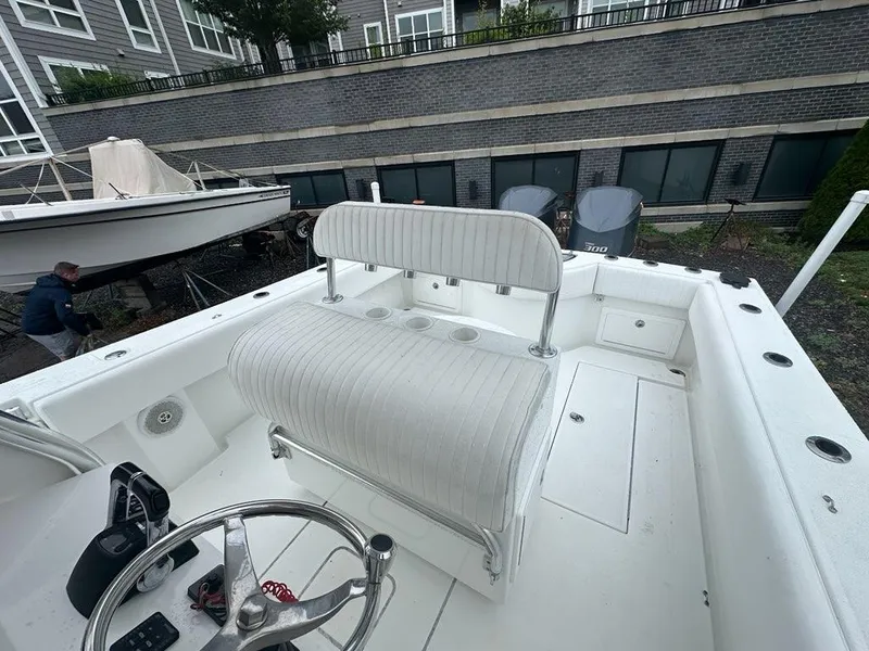 Slide: The Image of 2012 Onslow Bay 27 OE boat interior with seating and steering wheel. - 12