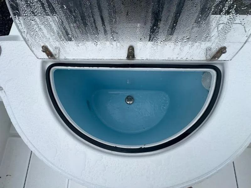 Slide: The Image of Livewell on a 2012 Onslow Bay 27 OE boat, featuring a blue interior and clear lid. - 17