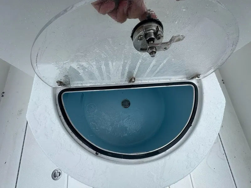 Slide: The Image of Livewell compartment on a 2012 Onslow Bay 27 OE boat, open lid view. - 18