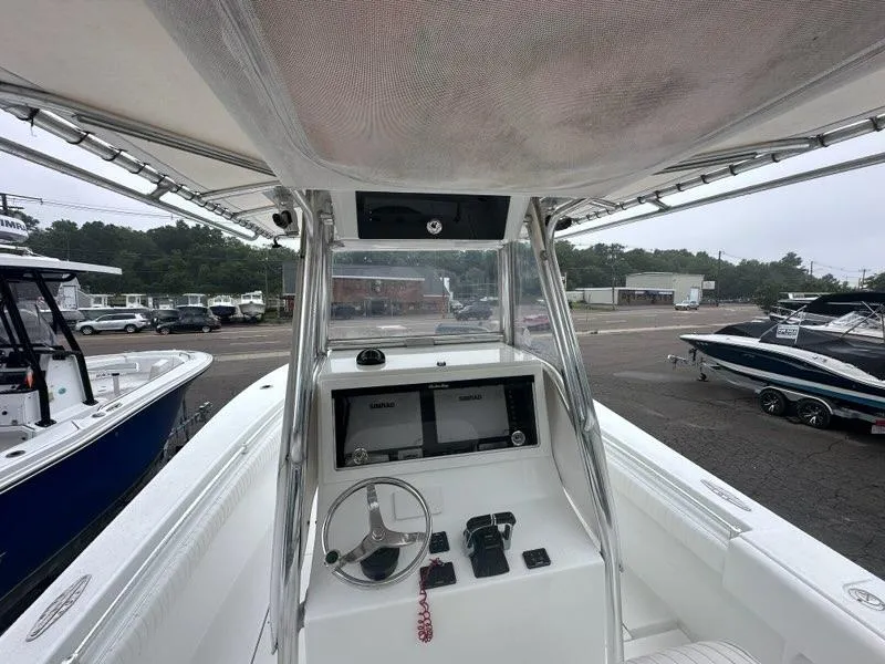 Slide: The Image of 2012 Onslow Bay 27 OE boat cockpit with steering wheel and navigation equipment. - 4