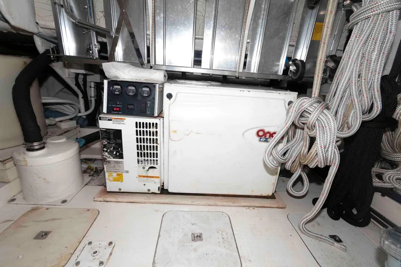 Slide: The Image of Engine room of 2003 Princess 50 yacht with generator and coiled ropes. - 36