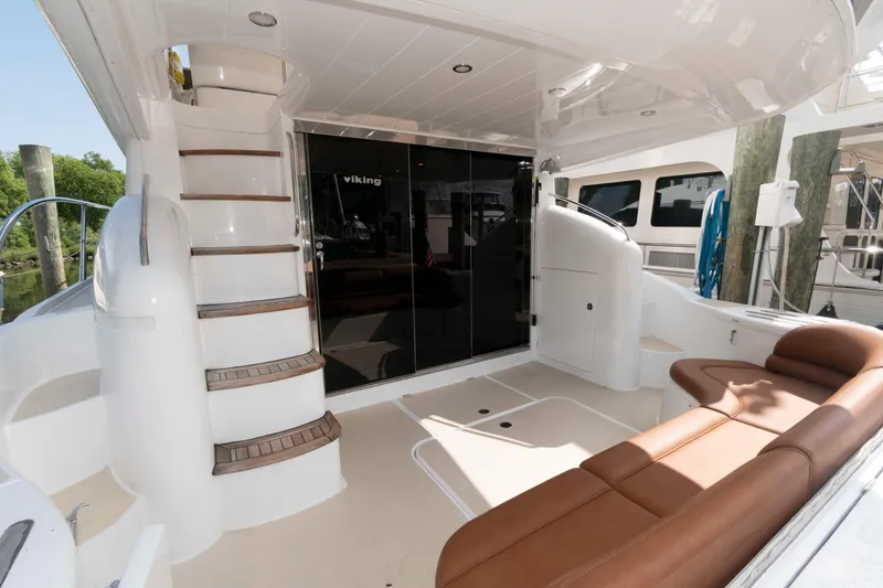 Slide: The Image of Luxurious 2003 Princess 50 yacht interior with brown seating and elegant staircase. - 5