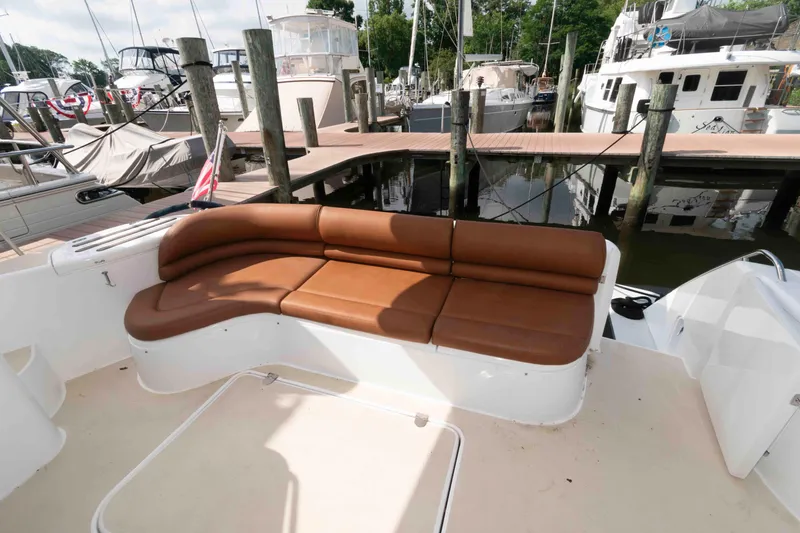 Slide: The Image of Luxury yacht seating area on a 2003 Princess 50, docked at a marina. - 6