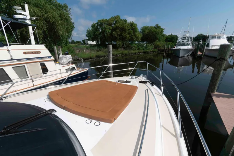 Slide: The Image of Luxury 2003 Princess 50 yacht docked, featuring spacious deck and sleek design. - 13