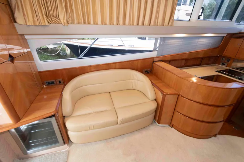 Slide: The Image of Luxurious interior of 2003 Princess 50 yacht with leather sofa and wooden cabinetry. - 21