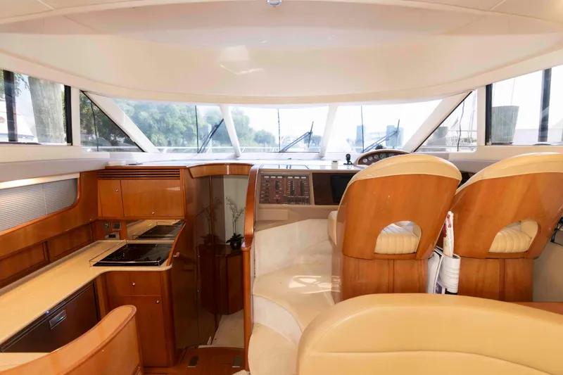 Slide: The Image of Luxurious interior of a 2003 Princess 50 yacht with helm and kitchen area. - 22