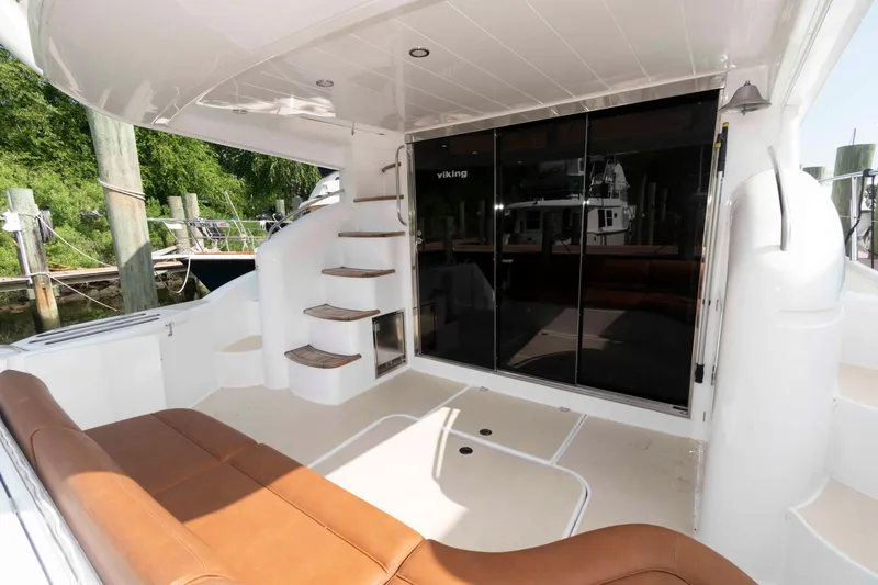 Slide: The Image of Luxurious 2003 Princess 50 yacht interior with brown seating and elegant staircase. - 4