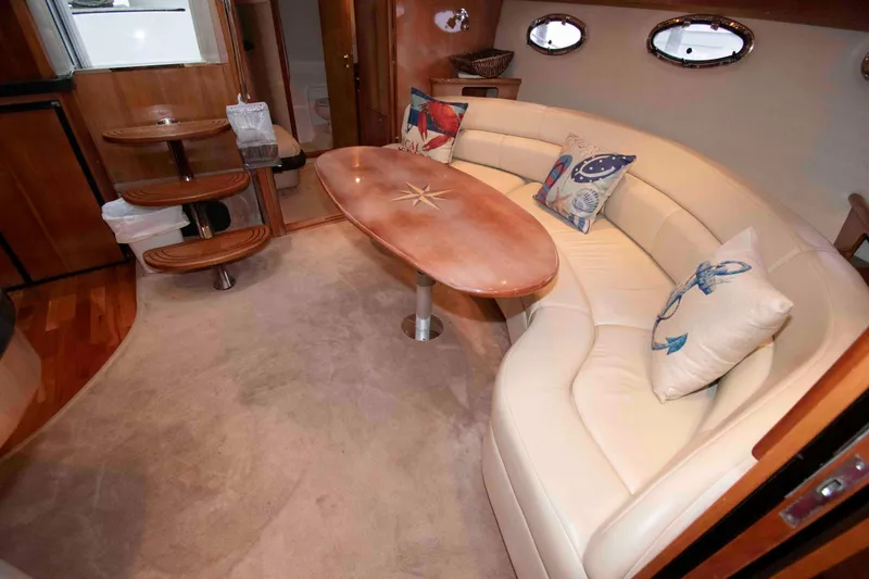 Slide: The Image of Luxurious interior of 2003 Regal Commodore 4260 yacht with plush seating and nautical decor. - 17
