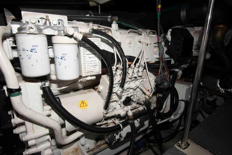 Slide: The Image of Engine of a 2003 Regal Commodore 4260 boat, showcasing intricate components and wiring. - 24