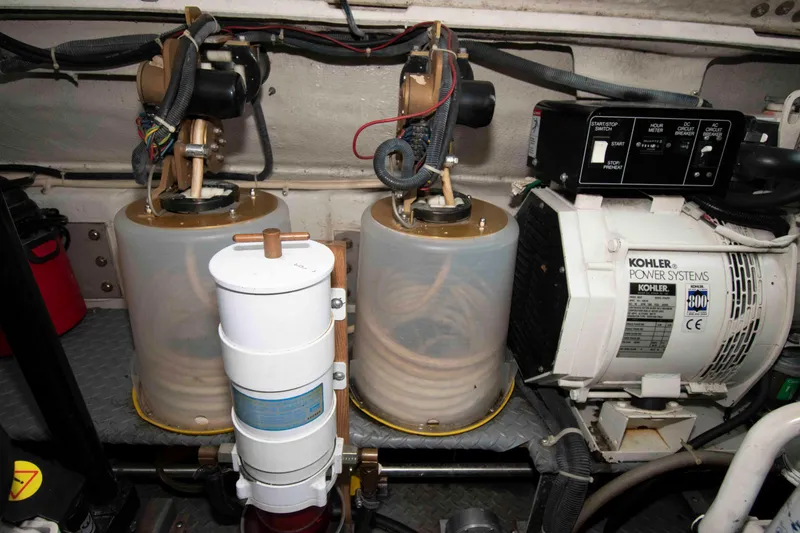 Slide: The Image of Engine room of 2003 Regal Commodore 4260 with Kohler power systems and fuel filters. - 26