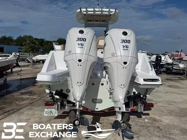 Slide: The Image of Rear view of 2026 Everglades 285 Center Console with twin 300 HP engines. - 2