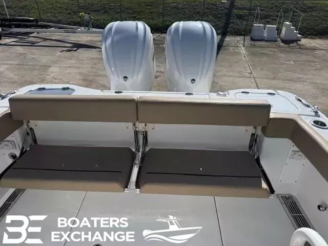 Slide: The Image of Everglades 285 Center Console 2026 with dual engines and seating bench. - 4