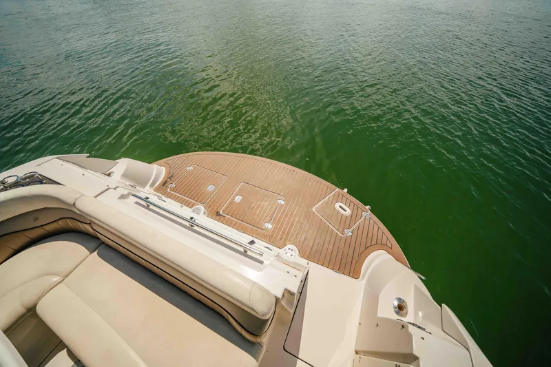 Slide: The Image of 2006 Four Winns 348 Vista boat deck overlooking calm green water. - 23