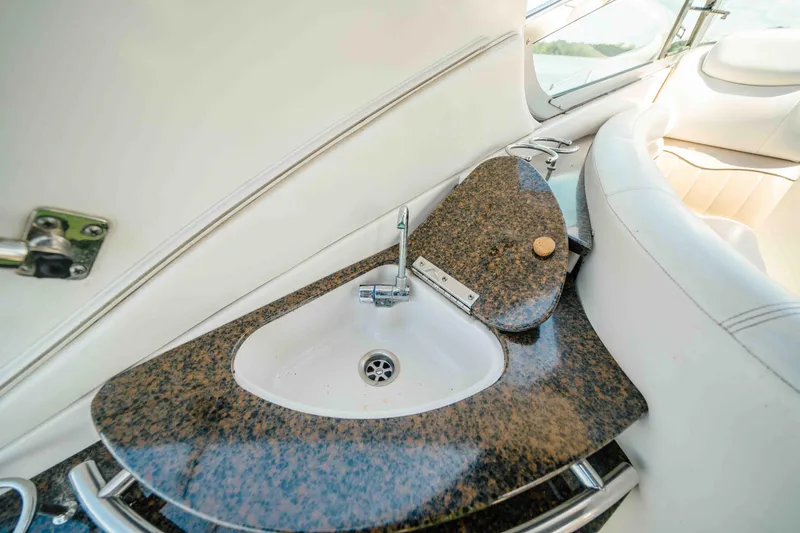 Slide: The Image of 2006 Four Winns 348 Vista boat interior with granite countertop and sink. - 27